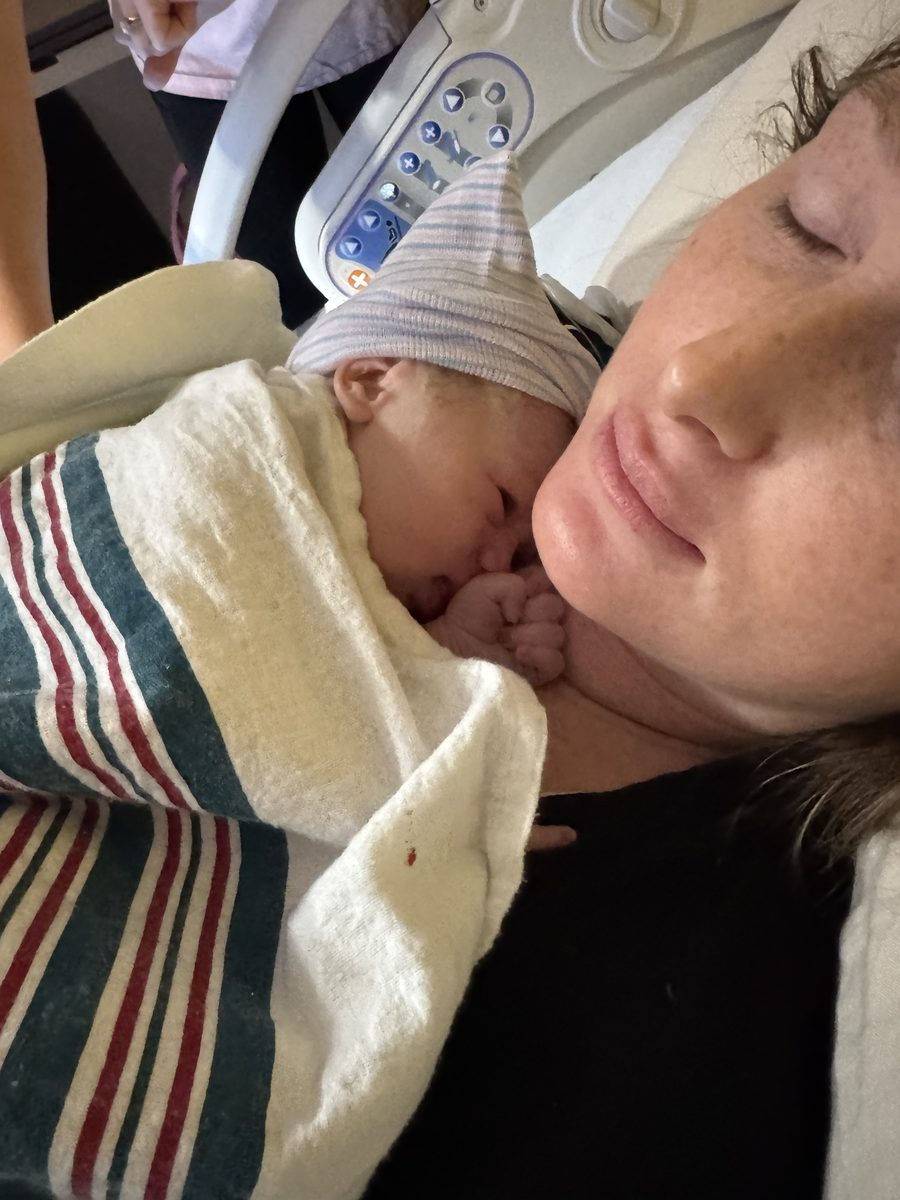 Mother resting with her newborn after birth